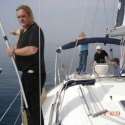 A man shows something on the sea