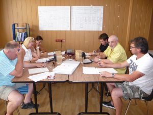6 persons at a boat school exam
